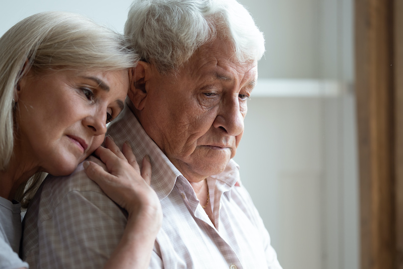 Senior spouses remember sad moments of life together, middle-aged adult daughter snuggle up to elderly father sharing his sorrows and heartache, embrace as symbol of empathy and compassion concept