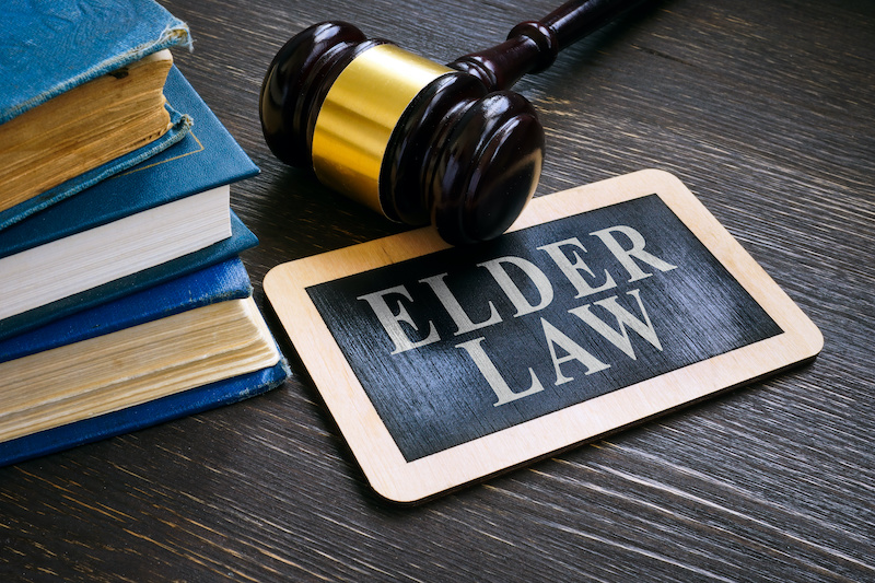 Gavel with elder law plate and books.