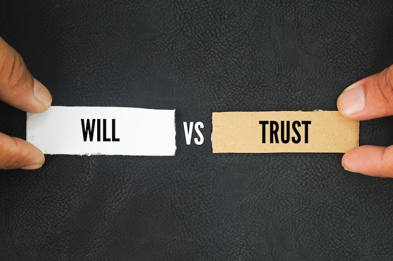 Paper with the words trust vs will. living trust might be more than you need for your situation, but it can be a great tool if you have a larger or more complex estate.