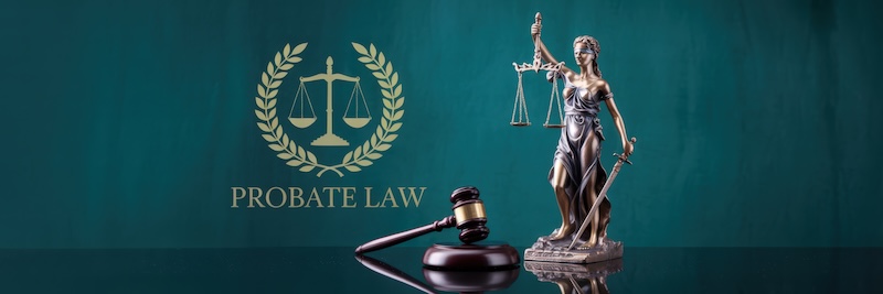 Bronze statue of Lady Justice, holding a sword and scales, next to a wooden gavel on a dark surface, with a dark teal background. The words PROBATE LAW are visible below the statue.