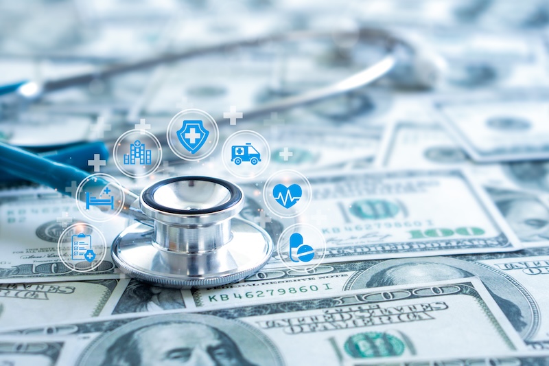 Health insurance and medical welfare concept. Stethoscope with health care icon on dollar bill background. The cost of healthcare. Medical technology, health insurance business.