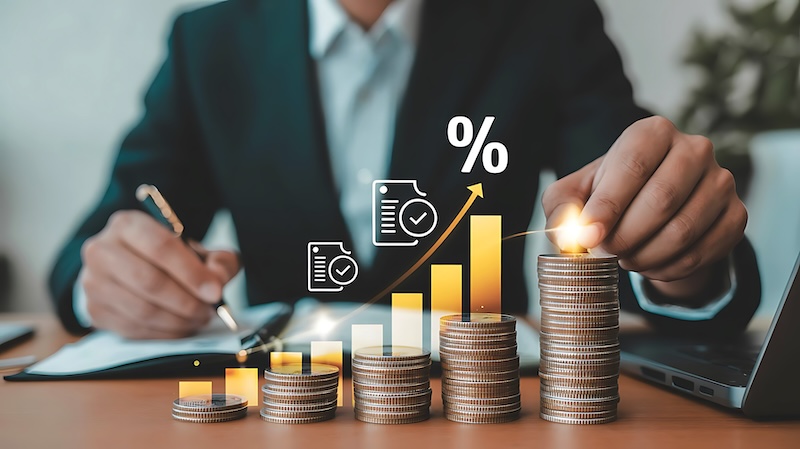 An investor is focused on financial growth reviewing investment documents and evaluating strategies to maximize returns A visual representation of rising interest rates and the pursuit of successful business financial planning The image signifies proactive financial management in a dynamic economic landscape investing wisely and securing a prosperous financial future