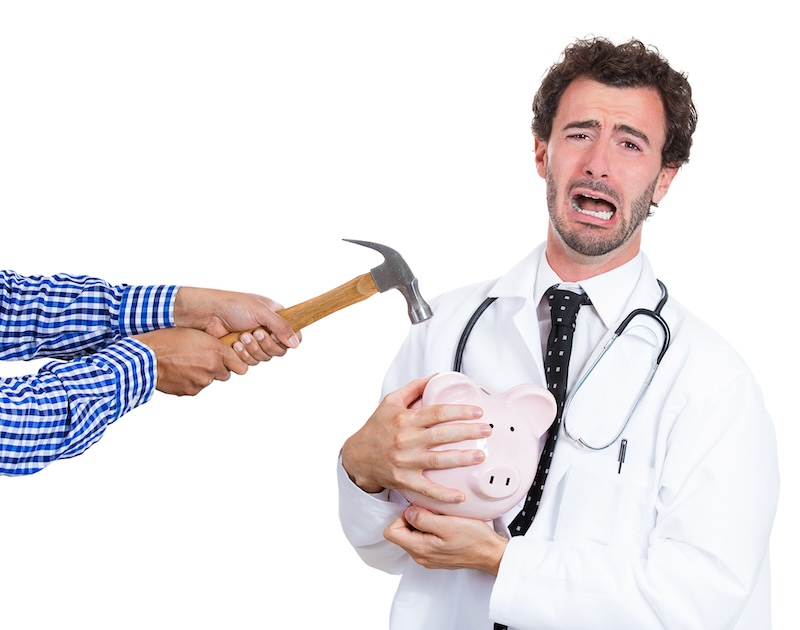 Closeup portrait, male healthcare professional, doctor, nurse with stethoscope protecting piggy bank, someone trying crack open to take out and steal his money, isolated white background.
