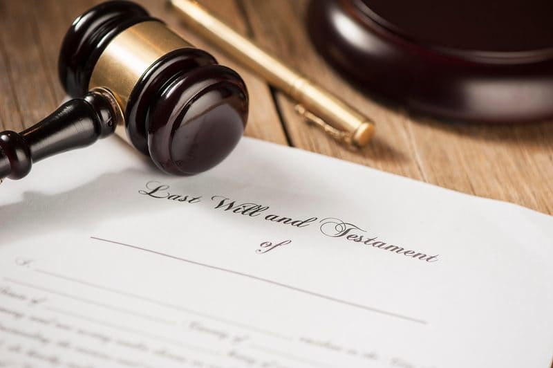 Last Will and Testament form next to a judge's gavel