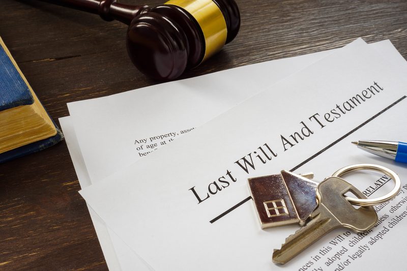 Last Will and Testament on a desk with house keys and a judge's gavel